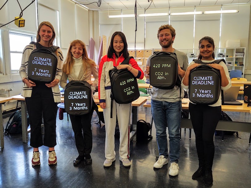 Group showing off Climate LED backpacks