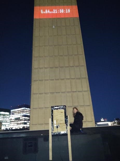 Jillian next to the projector on the West face