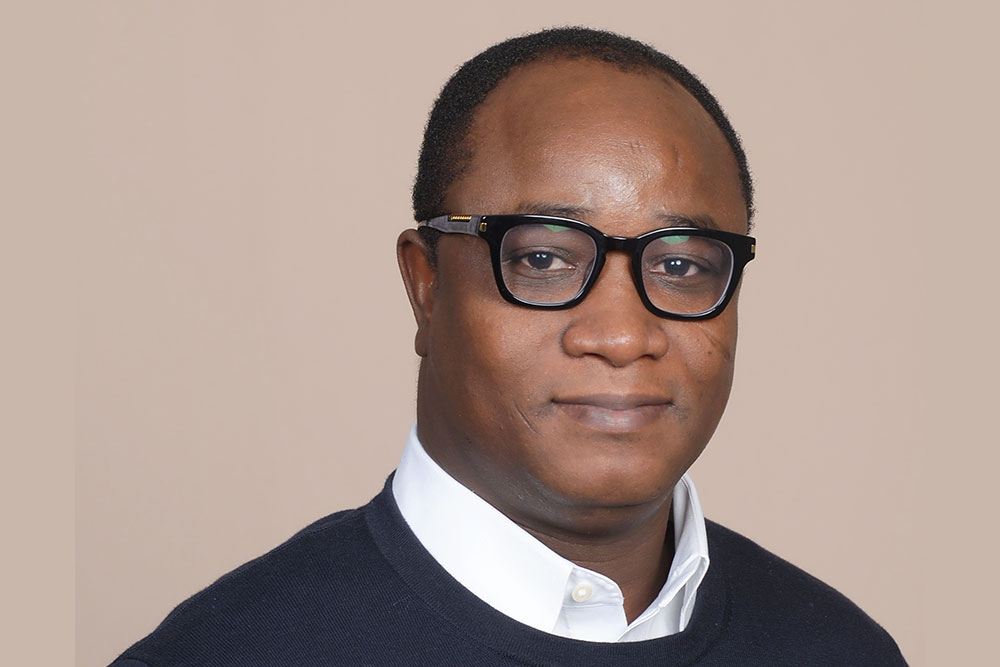 Headshot of Ericmoore Jossou, male faculty member, against a tan background, MIT